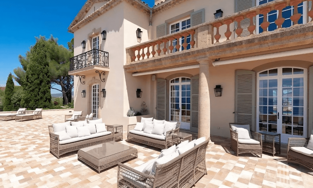Stylish bedroom suite with plush bedding and sea view balcony
